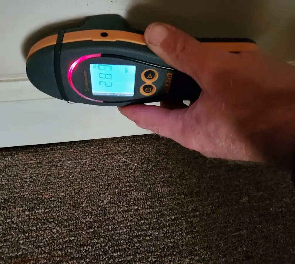 Moisture detection at baseboard during Storm Damage Restoration in Plattsburgh
